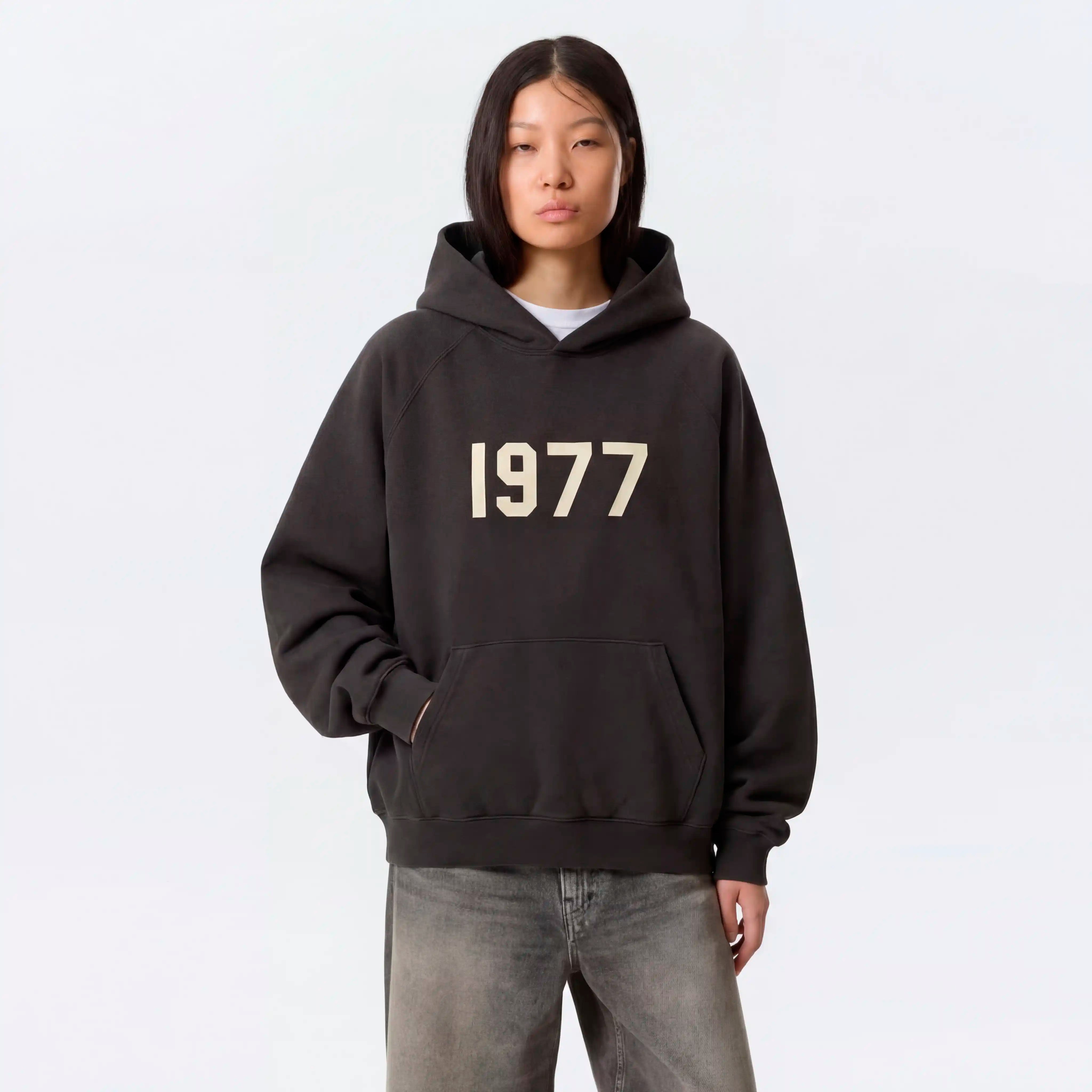 Model wearing Essentials 1977 hoodie iron