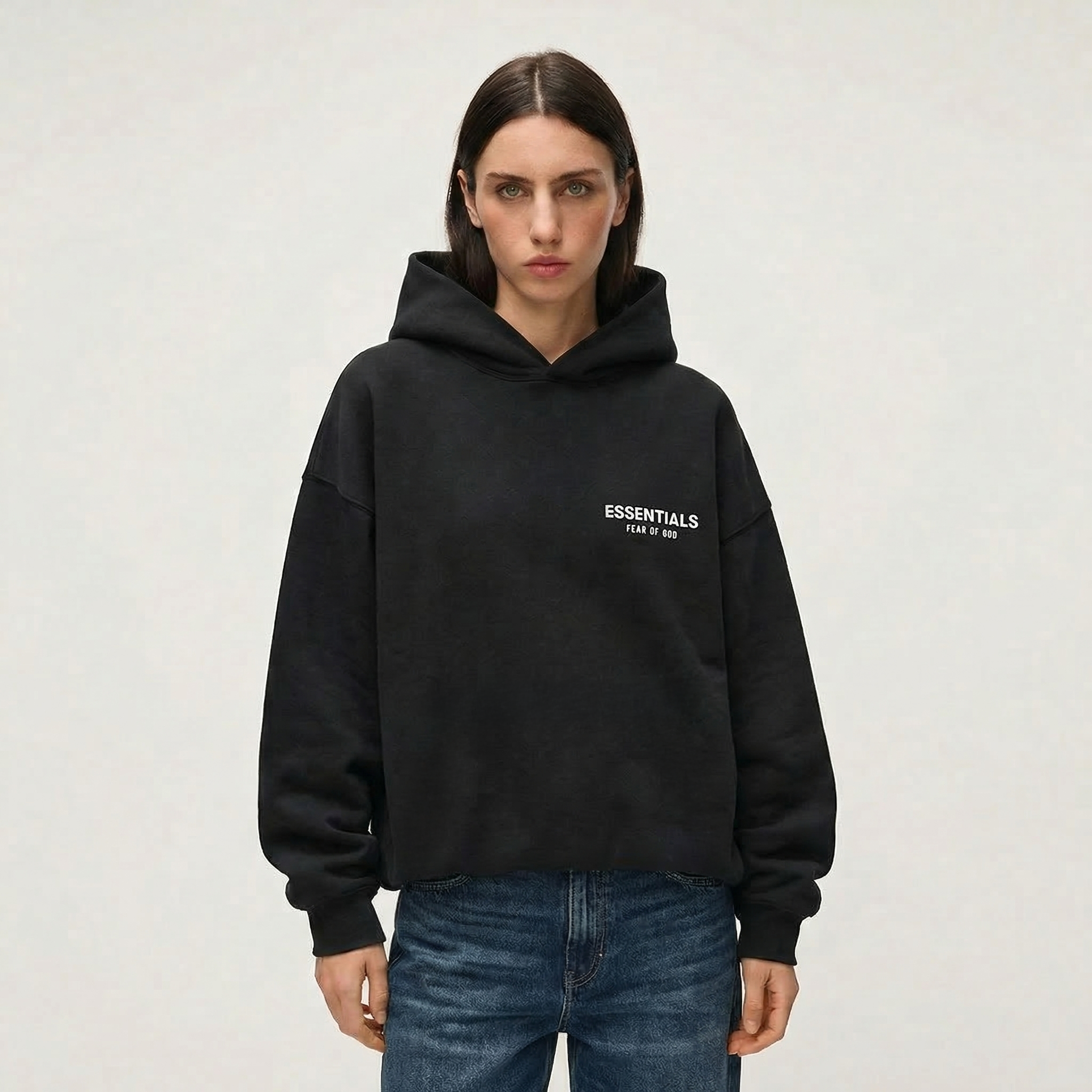Female model wearing Essentials Hoodie Black 
